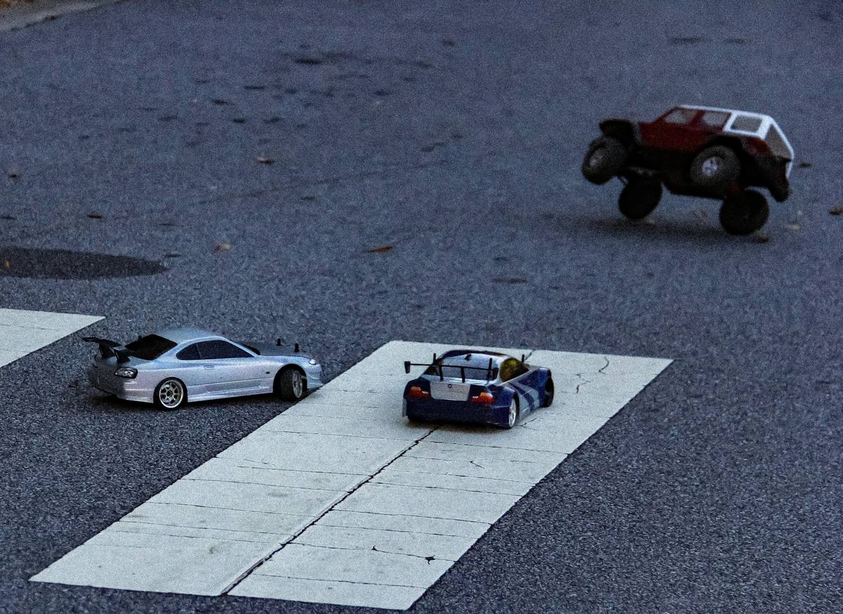 Side-by-side comparison of budget vs pro slot car racing setups illustrating what is slot car racing